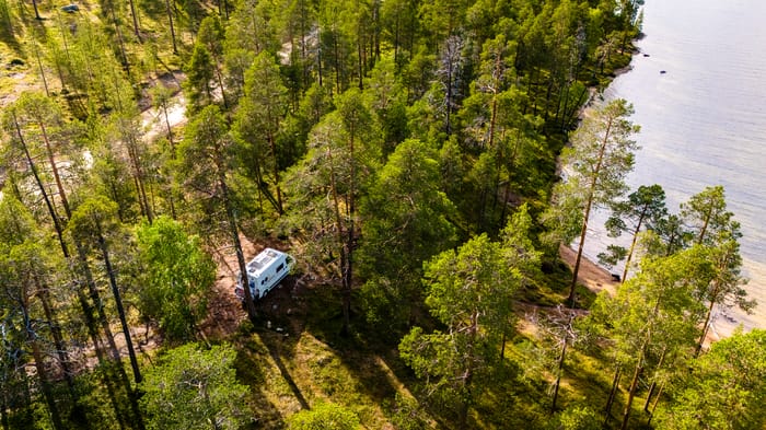 camper-van-nestled-in-finnish-lapland-forest-2026